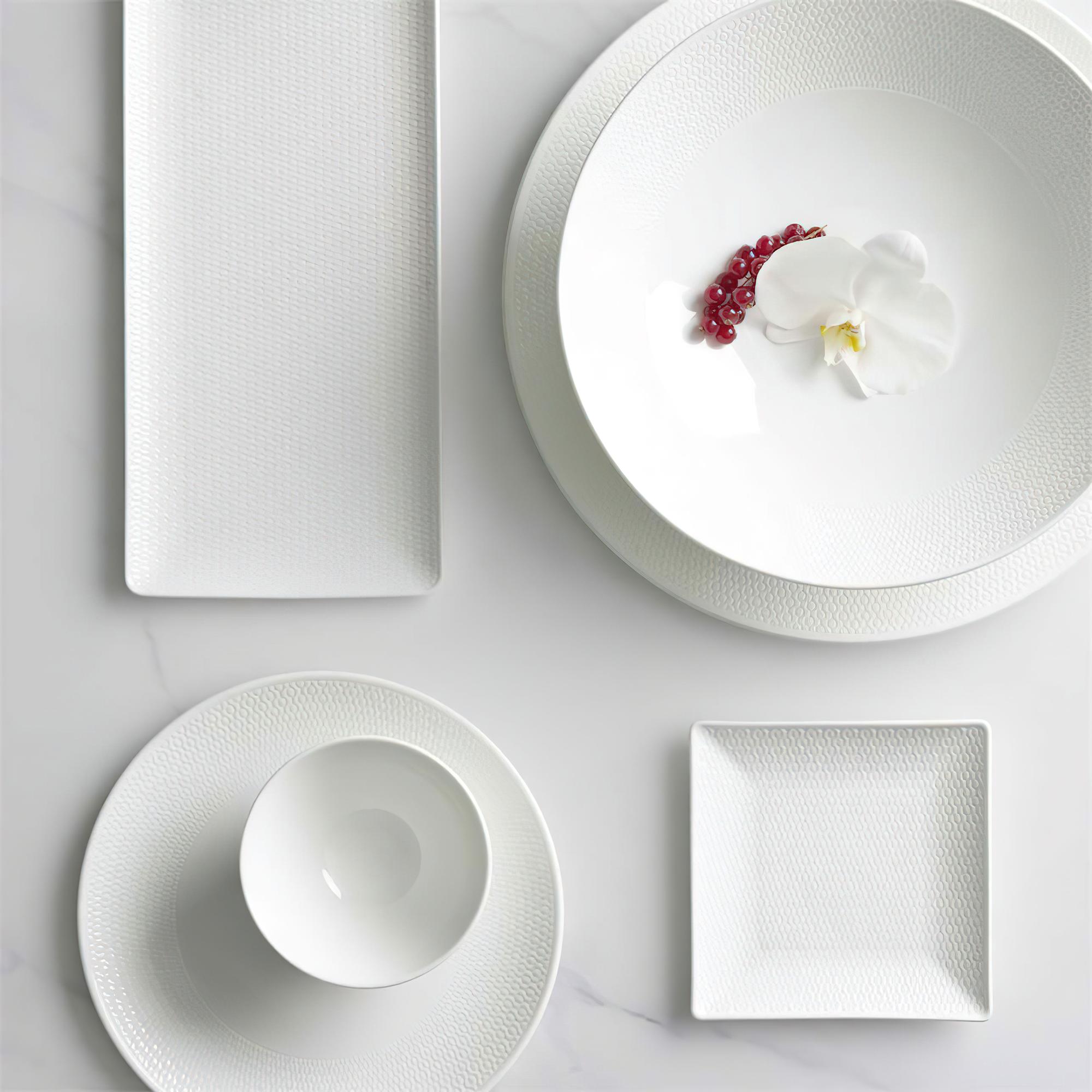 Stylish table setting and plated entrée